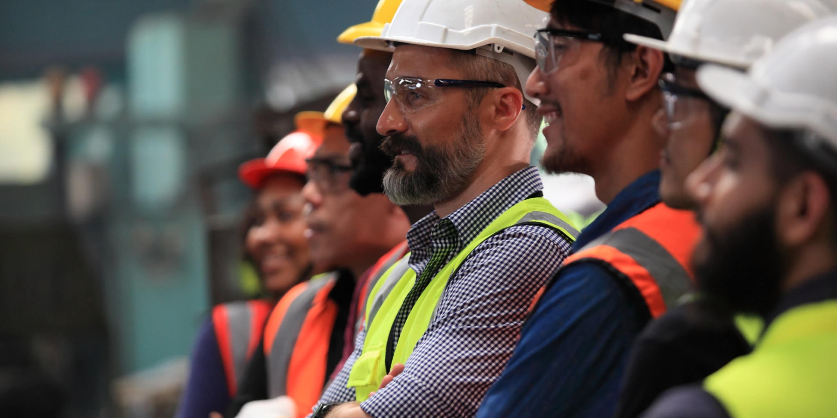 Several industry workers receiving on-site training from Honeywell instructors.