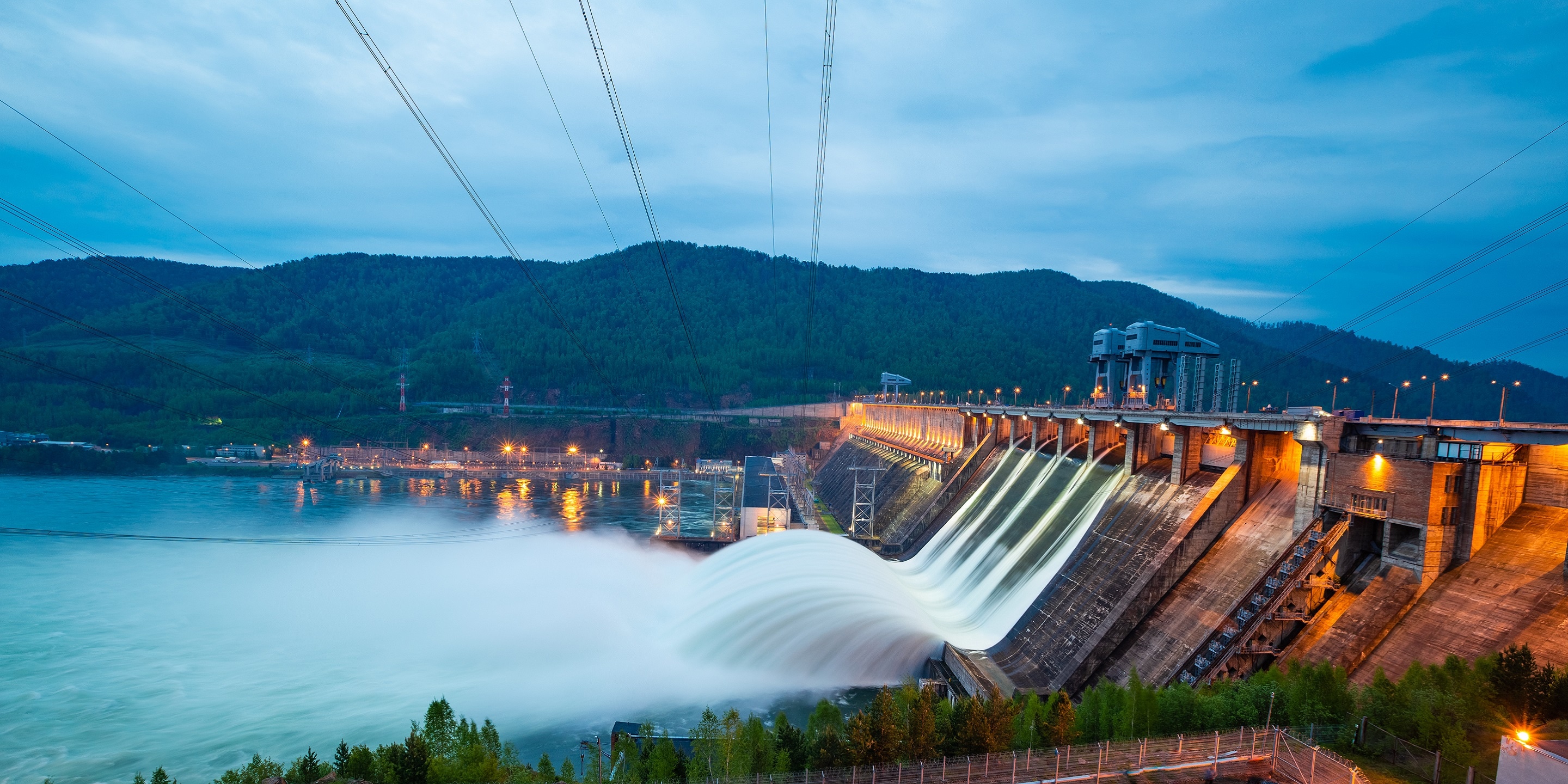 view of the hydroelectric dam, water discharge through locks, long exposure shooting